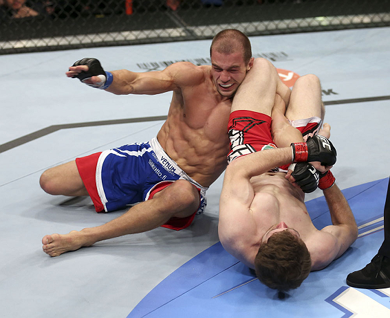 CALGARY, CANADA - JULY 21: (R-L) Mitch Clarke attempts an armbar against Anton Kuivanen during their lightweight bout at UFC 149 inside the Scotiabank Saddledome on July 21, 2012 in Calgary, Alberta, Canada. (Photo by Nick Laham/Zuffa LLC/Zuffa LLC via G