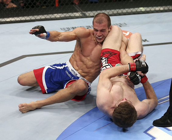 CALGARY, CANADA - JULY 21: (R-L) Mitch Clarke attempts an armbar against Anton Kuivanen during their lightweight bout at UFC 149 inside the Scotiabank Saddledome on July 21, 2012 in Calgary, Alberta, Canada.  (Photo by Nick Laham/Zuffa LLC/Zuffa LLC via G