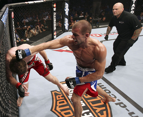 CALGARY, CANADA - JULY 21: (R-L) Anton Kuivanen throws a punch at Mitch Clarke during their lightweight bout at UFC 149 inside the Scotiabank Saddledome on July 21, 2012 in Calgary, Alberta, Canada. (Photo by Nick Laham/Zuffa LLC/Zuffa LLC via Getty Ima