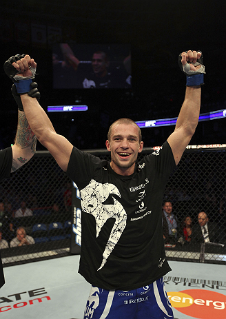 CALGARY, CANADA - JULY 21: Anton Kuivanen celebrates after defeating Mitch Clarke after their lightweight bout at UFC 149 inside the Scotiabank Saddledome on July 21, 2012 in Calgary, Alberta, Canada. (Photo by Nick Laham/Zuffa LLC/Zuffa LLC via Getty I