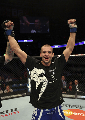 CALGARY, CANADA - JULY 21:  Anton Kuivanen celebrates after defeating Mitch Clarke after their lightweight bout at UFC 149 inside the Scotiabank Saddledome on July 21, 2012 in Calgary, Alberta, Canada.  (Photo by Nick Laham/Zuffa LLC/Zuffa LLC via Getty I