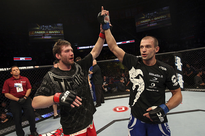 CALGARY, CANADA - JULY 21: (L-R) Mitch Clarke congratulates Anton Kuivanen after their lightweight bout at UFC 149 inside the Scotiabank Saddledome on July 21, 2012 in Calgary, Alberta, Canada. (Photo by Nick Laham/Zuffa LLC/Zuffa LLC via Getty Images)