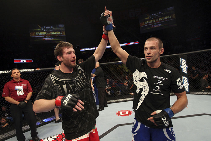 CALGARY, CANADA - JULY 21: (L-R) Mitch Clarke congratulates Anton Kuivanen after their lightweight bout at UFC 149 inside the Scotiabank Saddledome on July 21, 2012 in Calgary, Alberta, Canada.  (Photo by Nick Laham/Zuffa LLC/Zuffa LLC via Getty Images)