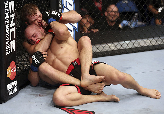 CALGARY, CANADA - JULY 21:  Bryan Caraway attempts to choke out Mitch Gagnon during their bantamweight bout at UFC 149 inside the Scotiabank Saddledome on July 21, 2012 in Calgary, Alberta, Canada.  (Photo by Nick Laham/Zuffa LLC/Zuffa LLC via Getty Image