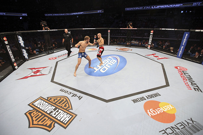 CALGARY, CANADA - JULY 21: (L-R) Bryan Caraway throws a punch at Mitch Gagnon during their bantamweight bout at UFC 149 inside the Scotiabank Saddledome on July 21, 2012 in Calgary, Alberta, Canada. (Photo by Nick Laham/Zuffa LLC/Zuffa LLC via Getty Imag