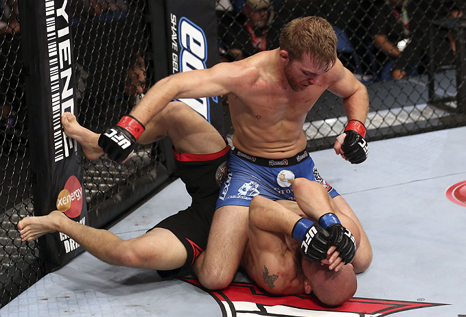 CALGARY, CANADA - JULY 21: (L-R) Bryan Caraway powers over Mitch Gagnon during their bantamweight bout at UFC 149 inside the Scotiabank Saddledome on July 21, 2012 in Calgary, Alberta, Canada. (Photo by Nick Laham/Zuffa LLC/Zuffa LLC via Getty Images)
