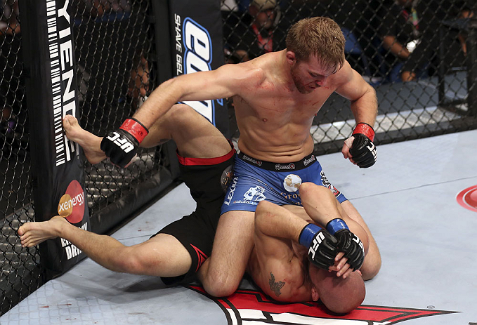 CALGARY, CANADA - JULY 21:  (L-R) Bryan Caraway powers over Mitch Gagnon during their bantamweight bout at UFC 149 inside the Scotiabank Saddledome on July 21, 2012 in Calgary, Alberta, Canada.  (Photo by Nick Laham/Zuffa LLC/Zuffa LLC via Getty Images)