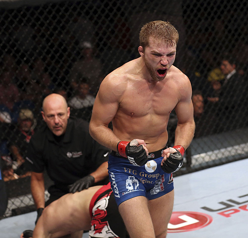 CALGARY, CANADA - JULY 21: Bryan Caraway celebrates after forcing Mitch Gagnon to tap out during their bantamweight bout at UFC 149 inside the Scotiabank Saddledome on July 21, 2012 in Calgary, Alberta, Canada.  (Photo by Nick Laham/Zuffa LLC/Zuffa LLC vi