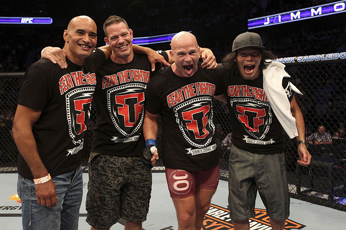 CALGARY, CANADA - JULY 21: Ryan Jimmo (second from right) celebrates with his corner after defeating Anthony Perosh during their light heavyweight bout at UFC 149 inside the Scotiabank Saddledome on July 21, 2012 in Calgary, Alberta, Canada. (Photo by Ni