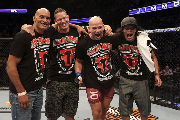 CALGARY, CANADA - JULY 21: Ryan Jimmo (second from right) celebrates with his corner after defeating Anthony Perosh during their light heavyweight bout at UFC 149 inside the Scotiabank Saddledome on July 21, 2012 in Calgary, Alberta, Canada.  (Photo by Ni