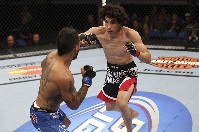 CALGARY, CANADA - JULY 21:  (R-L) Roland Delorme lunges at Francisco Rivera during their bantamweight bout at UFC 149 inside the Scotiabank Saddledome on July 21, 2012 in Calgary, Alberta, Canada.  (Photo by Nick Laham/Zuffa LLC/Zuffa LLC via Getty Images