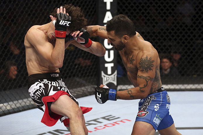 CALGARY, CANADA - JULY 21: (R-L) Francisco Rivera lands a punch to the head of Roland Delorme during their bantamweight bout at UFC 149 inside the Scotiabank Saddledome on July 21, 2012 in Calgary, Alberta, Canada. (Photo by Nick Laham/Zuffa LLC/Zuffa L