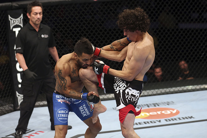 CALGARY, CANADA - JULY 21: (R-L) Roland Delorme lands a knee to the chin of Francisco Rivera during their bantamweight bout at UFC 149 inside the Scotiabank Saddledome on July 21, 2012 in Calgary, Alberta, Canada. (Photo by Nick Laham/Zuffa LLC/Zuffa LLC