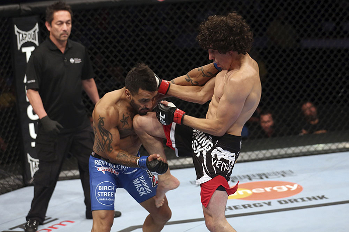 CALGARY, CANADA - JULY 21: (R-L) Roland Delorme lands a knee to the chin of Francisco Rivera during their bantamweight bout at UFC 149 inside the Scotiabank Saddledome on July 21, 2012 in Calgary, Alberta, Canada.  (Photo by Nick Laham/Zuffa LLC/Zuffa LLC