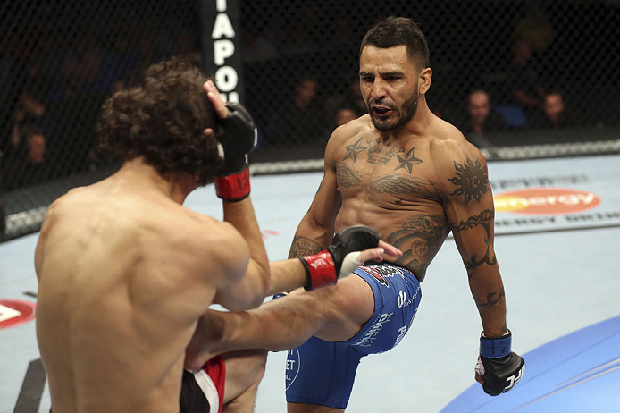 CALGARY, CANADA - JULY 21: (R-L) Francisco Rivera lands a kick to Roland Delorme during their bantamweight bout at UFC 149 inside the Scotiabank Saddledome on July 21, 2012 in Calgary, Alberta, Canada. (Photo by Nick Laham/Zuffa LLC/Zuffa LLC via Getty I