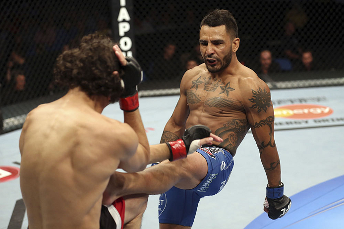 CALGARY, CANADA - JULY 21: (R-L) Francisco Rivera lands a kick to Roland Delorme during their bantamweight bout at UFC 149 inside the Scotiabank Saddledome on July 21, 2012 in Calgary, Alberta, Canada.  (Photo by Nick Laham/Zuffa LLC/Zuffa LLC via Getty I