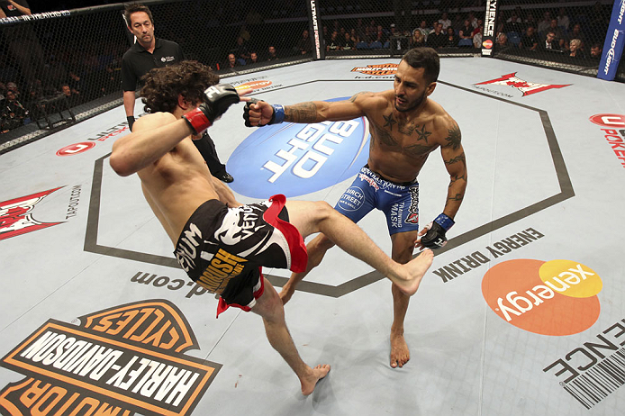 CALGARY, CANADA - JULY 21: (R-L) Francisco Rivera lands a punch to the head of Roland Delorme during their bantamweight bout at UFC 149 inside the Scotiabank Saddledome on July 21, 2012 in Calgary, Alberta, Canada. (Photo by Nick Laham/Zuffa LLC/Zuffa L