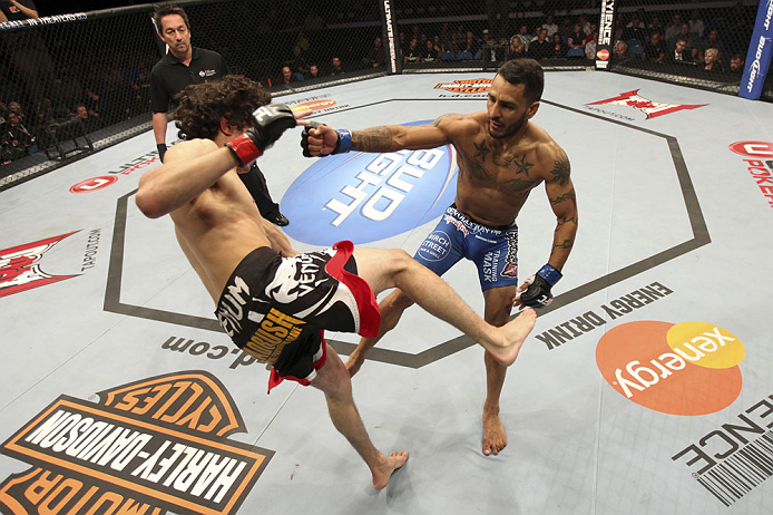 CALGARY, CANADA - JULY 21:  (R-L) Francisco Rivera lands a punch to the head of Roland Delorme during their bantamweight bout at UFC 149 inside the Scotiabank Saddledome on July 21, 2012 in Calgary, Alberta, Canada.  (Photo by Nick Laham/Zuffa LLC/Zuffa L