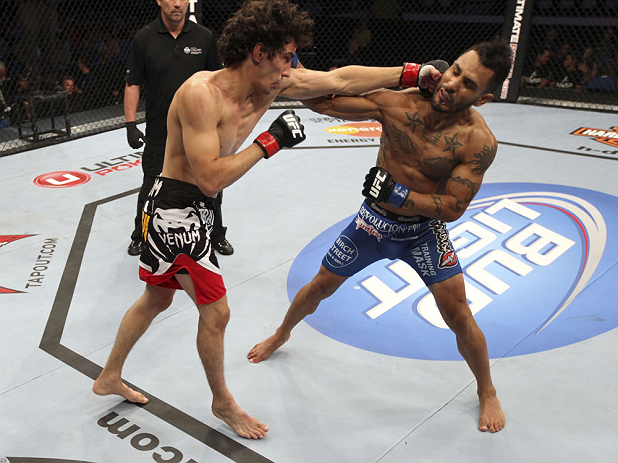 CALGARY, CANADA - JULY 21: (R-L) Francisco Rivera lands a punch to the head of Roland Delorme during their bantamweight bout at UFC 149 inside the Scotiabank Saddledome on July 21, 2012 in Calgary, Alberta, Canada. (Photo by Nick Laham/Zuffa LLC/Zuffa L