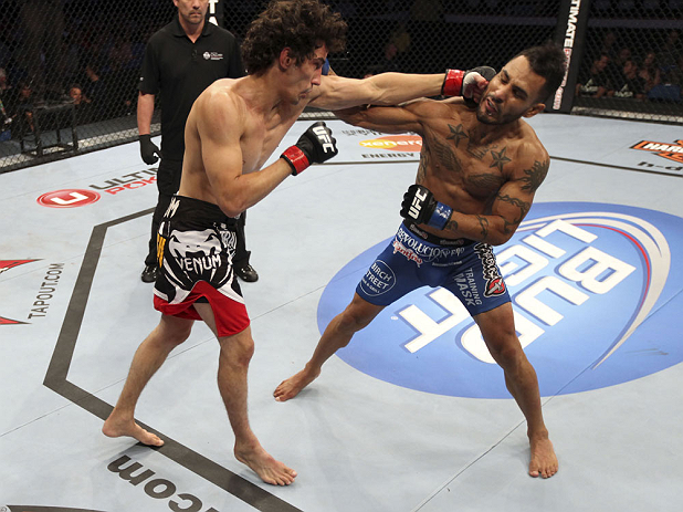 CALGARY, CANADA - JULY 21:  (R-L) Francisco Rivera lands a punch to the head of Roland Delorme during their bantamweight bout at UFC 149 inside the Scotiabank Saddledome on July 21, 2012 in Calgary, Alberta, Canada.  (Photo by Nick Laham/Zuffa LLC/Zuffa L