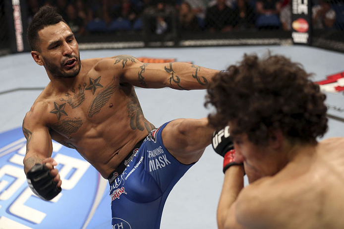 CALGARY, CANADA - JULY 21: (L-R) Francisco Rivera lands a kick to the head of Roland Delorme during their bantamweight bout at UFC 149 inside the Scotiabank Saddledome on July 21, 2012 in Calgary, Alberta, Canada. (Photo by Nick Laham/Zuffa LLC/Zuffa LLC