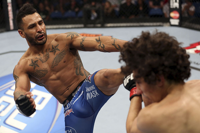 CALGARY, CANADA - JULY 21: (L-R) Francisco Rivera lands a kick to the head of Roland Delorme during their bantamweight bout at UFC 149 inside the Scotiabank Saddledome on July 21, 2012 in Calgary, Alberta, Canada.  (Photo by Nick Laham/Zuffa LLC/Zuffa LLC