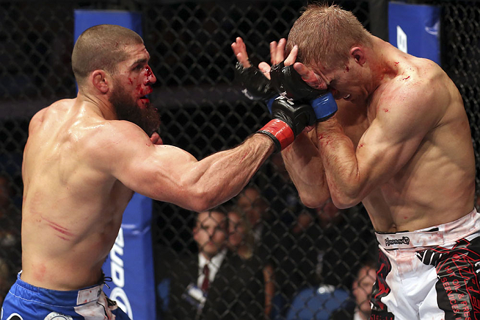 CALGARY, CANADA - JULY 21: (L-R) Court McGee throws a punch at Nick Ring during their middleweight bout at UFC 149 inside the Scotiabank Saddledome on July 21, 2012 in Calgary, Alberta, Canada. (Photo by Nick Laham/Zuffa LLC/Zuffa LLC via Getty Images)