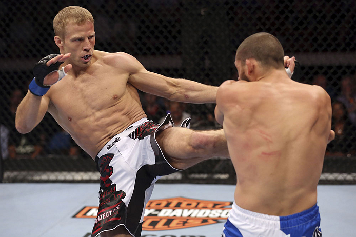 CALGARY, CANADA - JULY 21: (L-R) Nick Ring lands a kick to Court McGee during their middleweight bout at UFC 149 inside the Scotiabank Saddledome on July 21, 2012 in Calgary, Alberta, Canada. (Photo by Nick Laham/Zuffa LLC/Zuffa LLC via Getty Images)