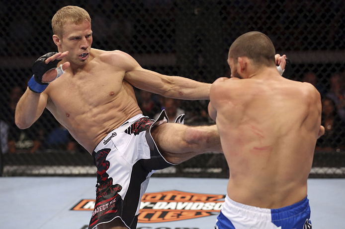 CALGARY, CANADA - JULY 21: (L-R) Nick Ring lands a kick to Court McGee during their middleweight bout at UFC 149 inside the Scotiabank Saddledome on July 21, 2012 in Calgary, Alberta, Canada.  (Photo by Nick Laham/Zuffa LLC/Zuffa LLC via Getty Images)