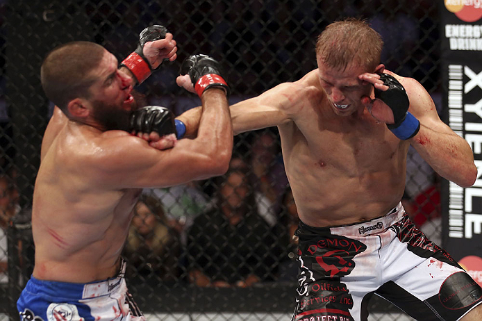 CALGARY, CANADA - JULY 21: (R-L) Nick Ring lands a punch to the head of Court McGee during their middleweight bout at UFC 149 inside the Scotiabank Saddledome on July 21, 2012 in Calgary, Alberta, Canada.  (Photo by Nick Laham/Zuffa LLC/Zuffa LLC via Gett