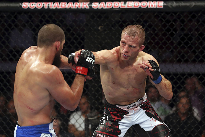CALGARY, CANADA - JULY 21: (R-L) Nick Ring throws a punch at Court McGee during their middleweight bout at UFC 149 inside the Scotiabank Saddledome on July 21, 2012 in Calgary, Alberta, Canada. (Photo by Nick Laham/Zuffa LLC/Zuffa LLC via Getty Images)