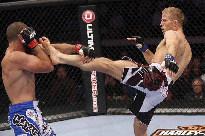 CALGARY, CANADA - JULY 21: (L-R) Court McGee blocks a kick from Nick Ring during their middleweight bout at UFC 149 inside the Scotiabank Saddledome on July 21, 2012 in Calgary, Alberta, Canada. (Photo by Nick Laham/Zuffa LLC/Zuffa LLC via Getty Images)
