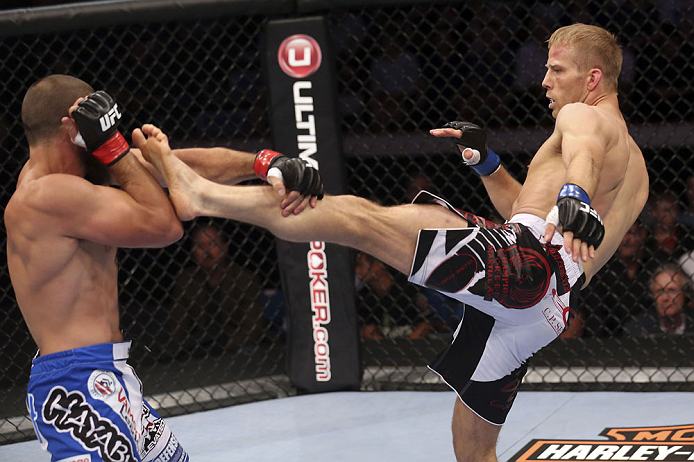 CALGARY, CANADA - JULY 21: (L-R) Court McGee blocks a kick from Nick Ring during their middleweight bout at UFC 149 inside the Scotiabank Saddledome on July 21, 2012 in Calgary, Alberta, Canada.  (Photo by Nick Laham/Zuffa LLC/Zuffa LLC via Getty Images)