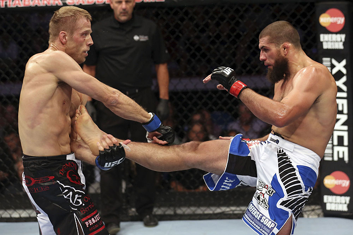 CALGARY, CANADA - JULY 21: (L-R) Nick Ring blocks a kick from Court McGee during their middleweight bout at UFC 149 inside the Scotiabank Saddledome on July 21, 2012 in Calgary, Alberta, Canada. (Photo by Nick Laham/Zuffa LLC/Zuffa LLC via Getty Images)