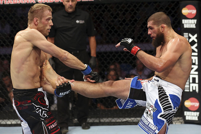 CALGARY, CANADA - JULY 21:  (L-R) Nick Ring blocks a kick from Court McGee during their middleweight bout at UFC 149 inside the Scotiabank Saddledome on July 21, 2012 in Calgary, Alberta, Canada.  (Photo by Nick Laham/Zuffa LLC/Zuffa LLC via Getty Images)