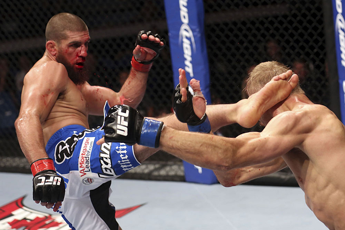 CALGARY, CANADA - JULY 21: Court McGee lands a kick to the head of Nick Ring during their middleweight bout at UFC 149 inside the Scotiabank Saddledome on July 21, 2012 in Calgary, Alberta, Canada. (Photo by Nick Laham/Zuffa LLC/Zuffa LLC via Getty Imag