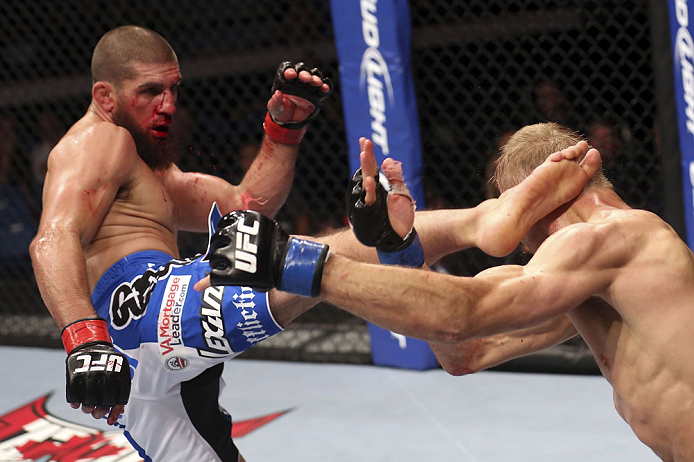 CALGARY, CANADA - JULY 21:  Court McGee lands a kick to the head of Nick Ring during their middleweight bout at UFC 149 inside the Scotiabank Saddledome on July 21, 2012 in Calgary, Alberta, Canada.  (Photo by Nick Laham/Zuffa LLC/Zuffa LLC via Getty Imag