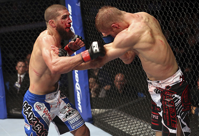 CALGARY, CANADA - JULY 21: Court McGee throws a punch at Nick Ring during their middleweight bout at UFC 149 inside the Scotiabank Saddledome on July 21, 2012 in Calgary, Alberta, Canada. (Photo by Nick Laham/Zuffa LLC/Zuffa LLC via Getty Images)