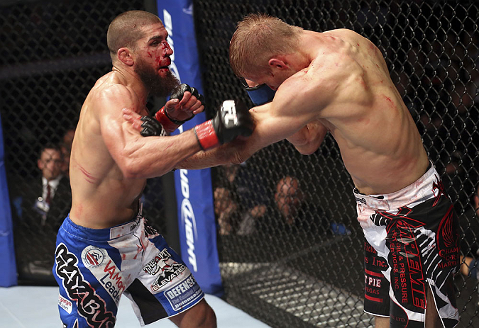 CALGARY, CANADA - JULY 21:  Court McGee throws a punch at Nick Ring during their middleweight bout at UFC 149 inside the Scotiabank Saddledome on July 21, 2012 in Calgary, Alberta, Canada.  (Photo by Nick Laham/Zuffa LLC/Zuffa LLC via Getty Images)