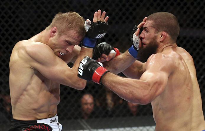 CALGARY, CANADA - JULY 21:  (L-R) Nick Ring exchanges strikes with Court McGee during their middleweight bout at UFC 149 inside the Scotiabank Saddledome on July 21, 2012 in Calgary, Alberta, Canada.  (Photo by Nick Laham/Zuffa LLC/Zuffa LLC via Getty Ima