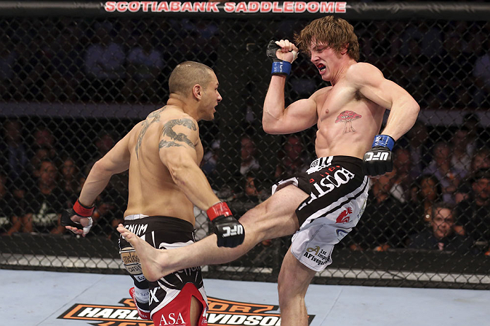 CALGARY, CANADA - JULY 21: (L-R) Chris Clements takes a kick from Matthew Riddle during their welterweight bout at UFC 149 inside the Scotiabank Saddledome on July 21, 2012 in Calgary, Alberta, Canada. (Photo by Nick Laham/Zuffa LLC/Zuffa LLC via Getty