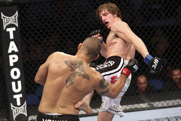 CALGARY, CANADA - JULY 21: (L-R) Chris Clements takes a kick from Matthew Riddle during their welterweight bout at UFC 149 inside the Scotiabank Saddledome on July 21, 2012 in Calgary, Alberta, Canada. (Photo by Nick Laham/Zuffa LLC/Zuffa LLC via Getty