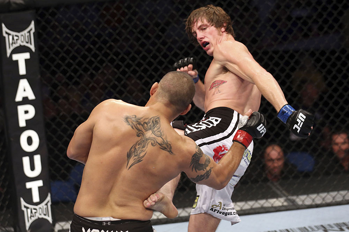 CALGARY, CANADA - JULY 21:  (L-R) Chris Clements takes a kick from Matthew Riddle during their welterweight bout at UFC 149 inside the Scotiabank Saddledome on July 21, 2012 in Calgary, Alberta, Canada.  (Photo by Nick Laham/Zuffa LLC/Zuffa LLC via Getty 