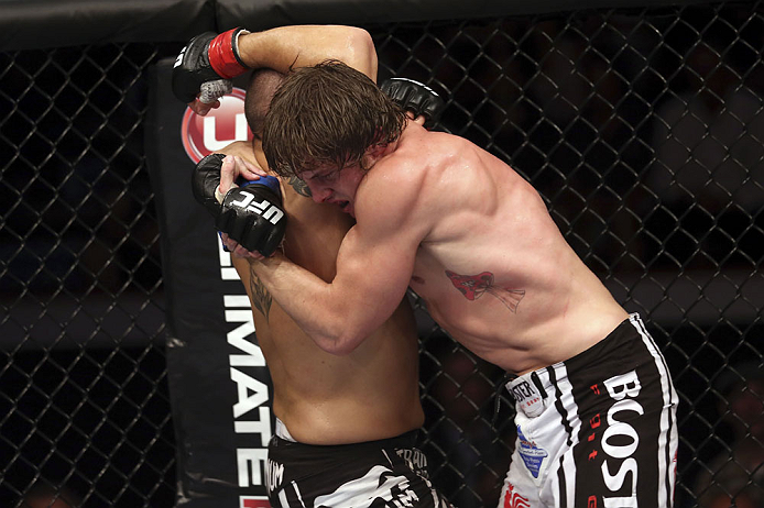 CALGARY, CANADA - JULY 21: (L-R) Chris Clements is caught by Matthew Riddle during their welterweight bout at UFC 149 inside the Scotiabank Saddledome on July 21, 2012 in Calgary, Alberta, Canada.  (Photo by Nick Laham/Zuffa LLC/Zuffa LLC via Getty Images