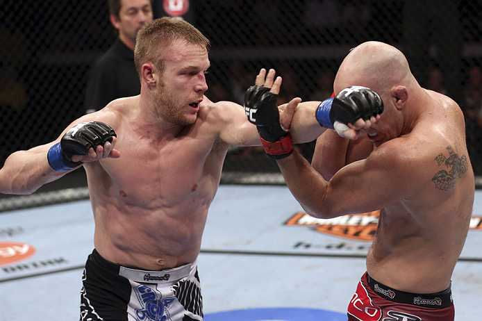 CALGARY, CANADA - JULY 21: (L-R) James Head throws a punch at Brian Ebersole during their welterweight bout at UFC 149 inside the Scotiabank Saddledome on July 21, 2012 in Calgary, Alberta, Canada.  (Photo by Nick Laham/Zuffa LLC/Zuffa LLC via Getty Image