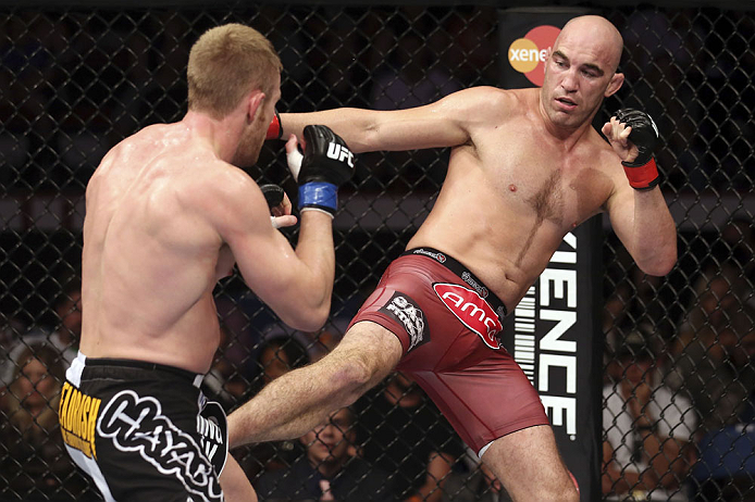 CALGARY, CANADA - JULY 21: (R-L) Brian Ebersole kicks James Head during their welterweight bout at UFC 149 inside the Scotiabank Saddledome on July 21, 2012 in Calgary, Alberta, Canada.  (Photo by Nick Laham/Zuffa LLC/Zuffa LLC via Getty Images)