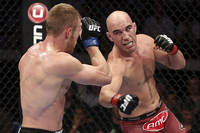 CALGARY, CANADA - JULY 21: (R-L) Brian Ebersole throws a punch at James Head during their welterweight bout at UFC 149 inside the Scotiabank Saddledome on July 21, 2012 in Calgary, Alberta, Canada.  (Photo by Nick Laham/Zuffa LLC/Zuffa LLC via Getty Image