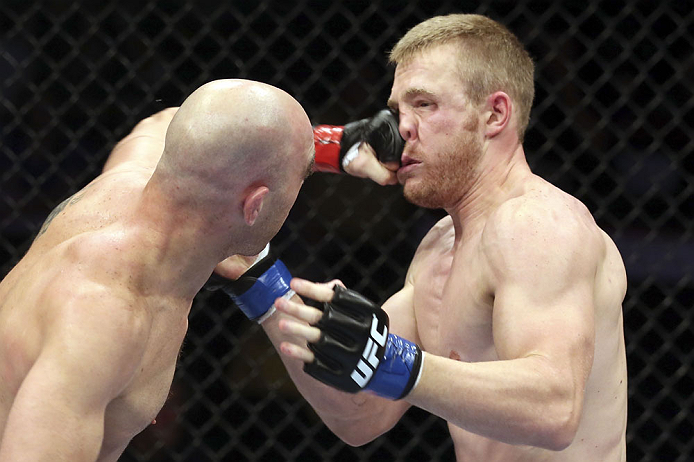 CALGARY, CANADA - JULY 21: (L-R) Brian Ebersole lands a punch on the face of James Head during their welterweight bout at UFC 149 inside the Scotiabank Saddledome on July 21, 2012 in Calgary, Alberta, Canada. (Photo by Nick Laham/Zuffa LLC/Zuffa LLC via