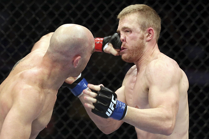 CALGARY, CANADA - JULY 21: (L-R) Brian Ebersole lands a punch on the face of James Head during their welterweight bout at UFC 149 inside the Scotiabank Saddledome on July 21, 2012 in Calgary, Alberta, Canada.  (Photo by Nick Laham/Zuffa LLC/Zuffa LLC via 