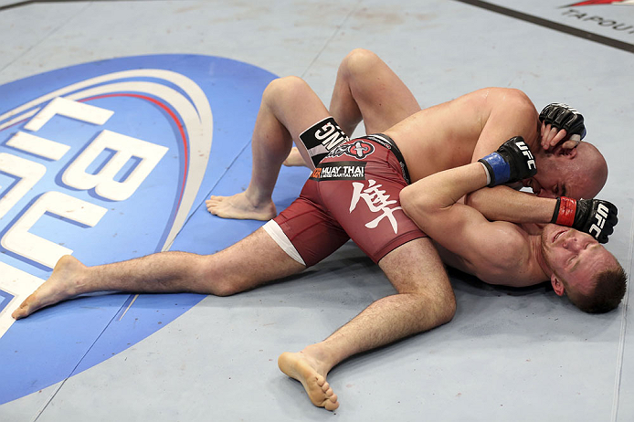 CALGARY, CANADA - JULY 21: (L-R) Brian Ebersole uses his body weight to get advantage of James Head during their welterweight bout at UFC 149 inside the Scotiabank Saddledome on July 21, 2012 in Calgary, Alberta, Canada.  (Photo by Nick Laham/Zuffa LLC/Zu